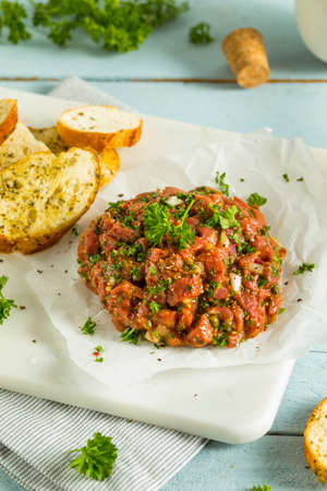 Raw Organic French Beef Tartare with Bread Slicesの写真素材