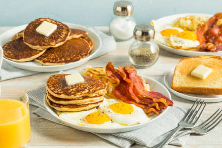 Healthy Full American Breakfast with Eggs Bacon and Pancakesの写真素材