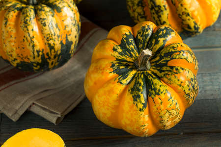Raw Orange Conffeti Acorn Squash Ready to be Cooked