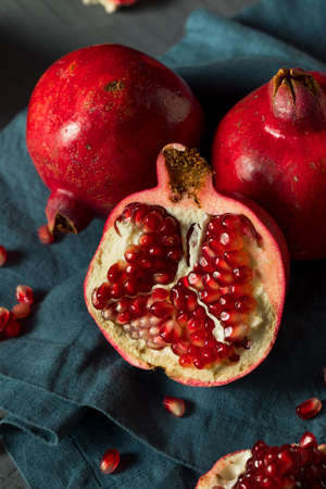 Raw Red Organic Pomegranates Split in Halfの写真素材