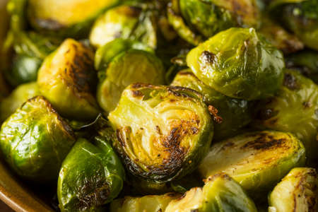 Homemade Roasted Green Brussel Sprouts in a Bowlの写真素材