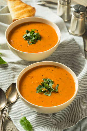 Homemade Tomato Basil Bisque Soup with Toastの写真素材