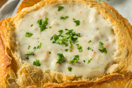 New England Clam Chowder in a Bread Bowl with Parsleyの写真素材