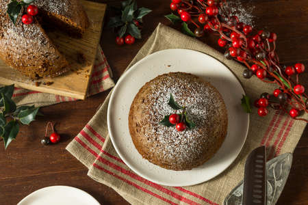 Sweet Homemade Christmas Figgy Pudding with Powdered Sugarの写真素材