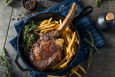 Cooked Grass Fed Tomahawk Steaks with Fries and Rosemary