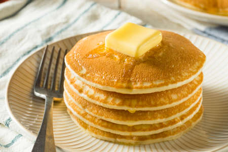 Sweet Homemade Stack of Pancakes with Butter and Syrup for Breakfast