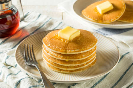 Sweet Homemade Stack of Pancakes with Butter and Syrup for Breakfast