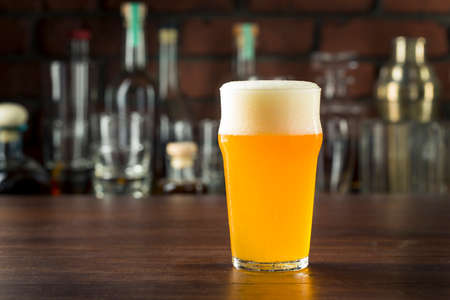 Refreshing Golden Beer Lager in a Pint Glassの写真素材