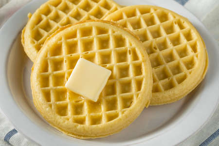 Brown Hot Freezer Waffles with Butter and Maple Syrupの写真素材