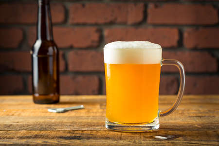 Refreshing Golden Beer Lager in a Pint Glassの写真素材