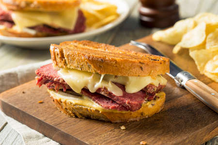 Savory Homemade Corned Beef Reuben Sandwich with Mustard and Cheeseの写真素材