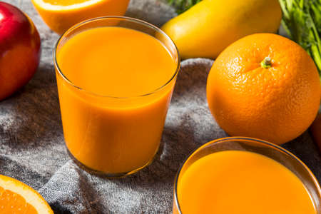 Healthy Organic Orange Carrot Smoothie Juice Drink with Mango and Banana