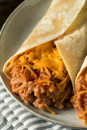 Homemade Bean and Cheese Burrito in a Tortillaの写真素材