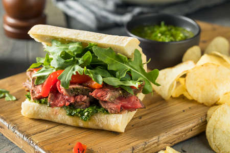 Homemade Beef Steak Sandwich with Chimichurri and Arugulaの写真素材