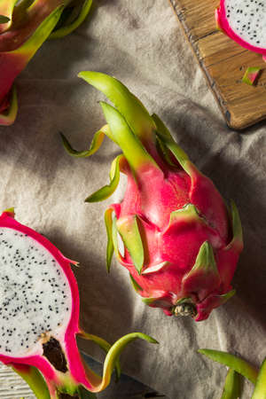 Raw Red Organic Dragon Fruit in a Bunchの写真素材