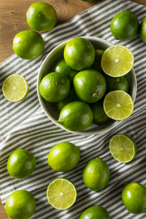 Raw Green Organic Citrus Limes Cut in Halfの写真素材