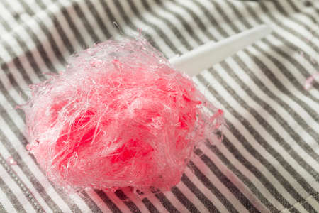 Sugary Pink Homemade Cotton Candy Floss on a Stickの写真素材
