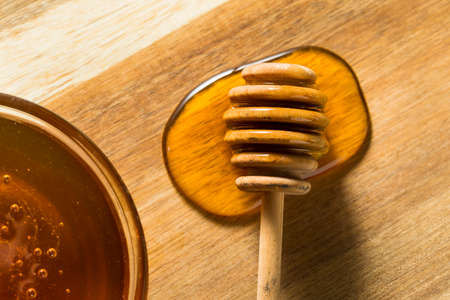 Raw Dark Organic BuckWheat Honey in a Bowlの写真素材