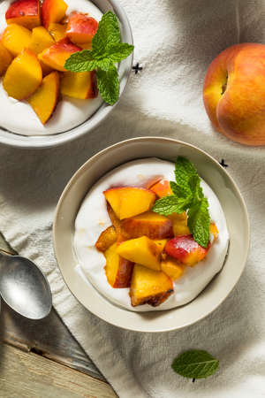 Homemade Sweet Peaches and Cream with Mintの写真素材