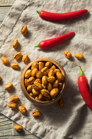 Homemade Spicy Shelled Pistachios in a Bowlの写真素材