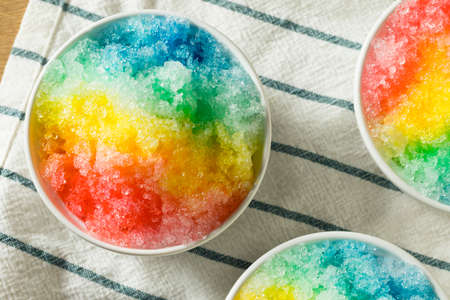 Sweet Homemade Shaved Rainbow Hawaiian Ice in a Bowlの写真素材