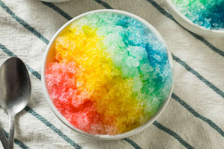 Sweet Homemade Shaved Rainbow Hawaiian Ice in a Bowlの写真素材