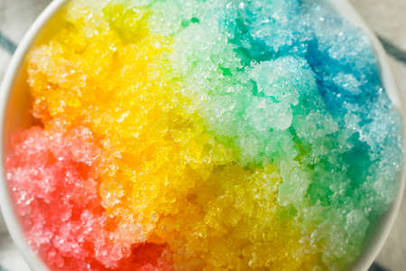 Sweet Homemade Shaved Rainbow Hawaiian Ice in a Bowlの写真素材