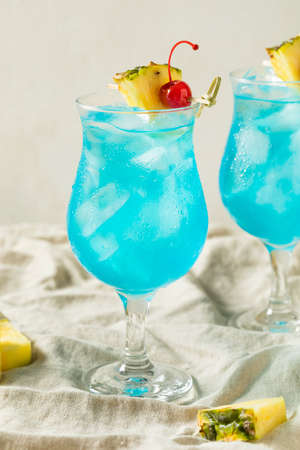 Boozy Blue Hawaii Hurricane Cocktail with Rum and Pineappleの写真素材