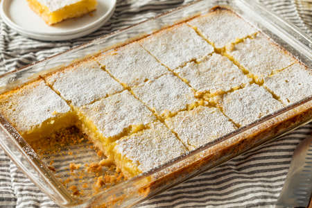 Sweet Homemade Lemon Bars with Powdered Sugar for Dessert