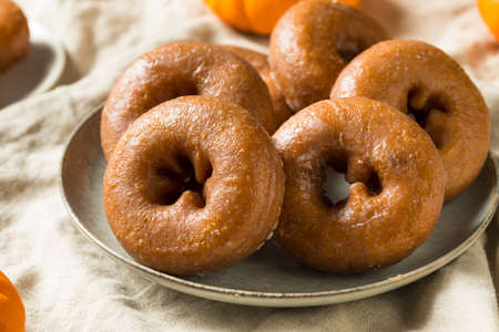 Homemade Pumpkin Spice Donuts Ready to Eatの写真素材