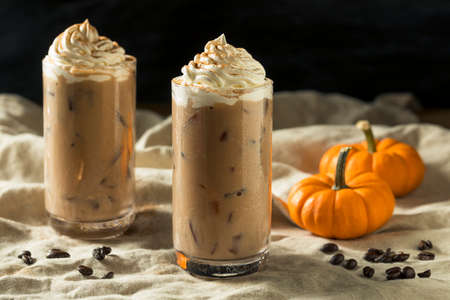 Sweet Refreshing Autumn Pumpkin Spice Latte Iced Coffee with Whipped Creamの写真素材