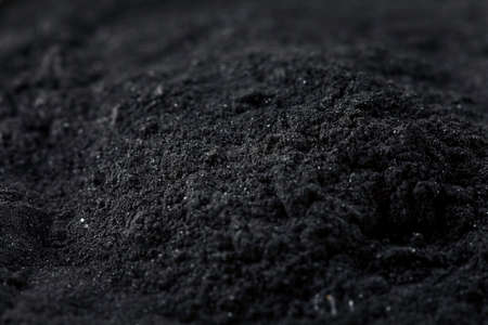 Raw Organic Black Activated Charcoal in a Bowlの写真素材