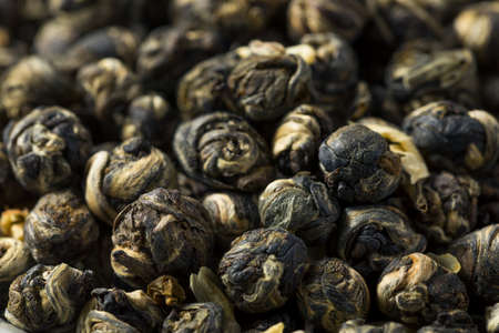 Dried Organic Jasmine Pearl Tea in a Bowl