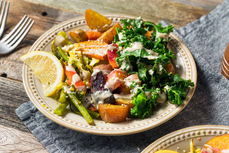 Cooked Organic Vegan Veggie Buddha Bowl with Tahini Sauceの写真素材