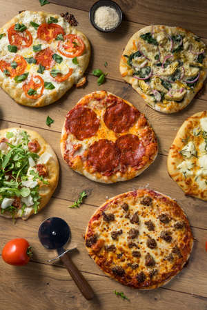Gourmet Homemade Assorted Wood Fired Pizzas with Pepperoni Basil and Cheese