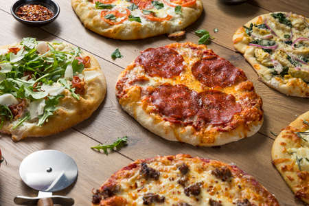 Gourmet Homemade Assorted Wood Fired Pizzas with Pepperoni Basil and Cheese