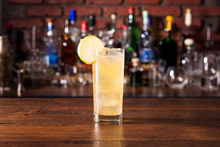 Refreshing Whiskey Ginger Cocktail on a Barの写真素材