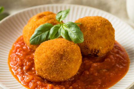 Homemade Deep Fried Risotto Arancini with Basil and Marinara