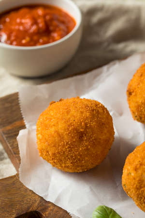 Homemade Deep Fried Risotto Arancini with Basil and Marinaraの写真素材