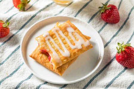 Sweet Breakfast Strawberry Toaster Pastry with Frostingの写真素材
