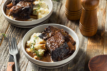 Homemade Braised Beef Short Ribs with Gravy and Potatoesの写真素材