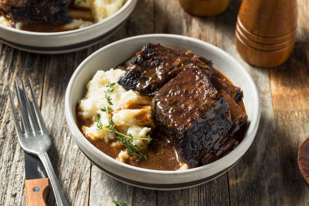 Homemade Braised Beef Short Ribs with Gravy and Potatoesの写真素材