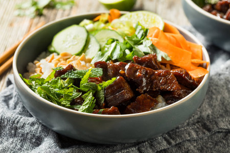Homemade Thai Beef and Rice Bowl with Veggies Herbsの写真素材