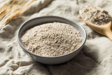 Organic Whole Wheat Flour in a Bowlの写真素材