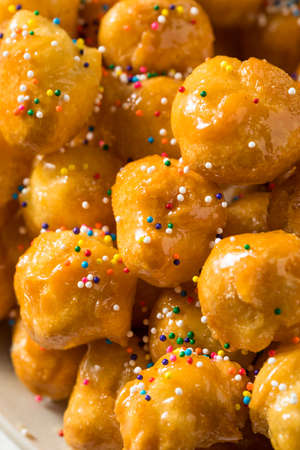 Homemade Sweet Italian Struffoli with Honey and Sprinklesの写真素材