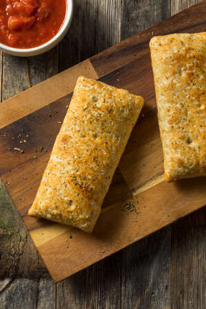 Unhealthy Microwaved Pizza Pockets with Cheese and Sauce