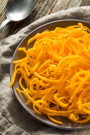 Raw Organic Butternut Squash Noodles in a Bowlの写真素材