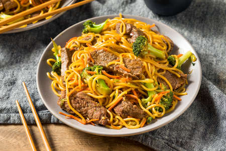 Homemade Beef Lo Mein Noodles with Carrots and Broccoliの写真素材