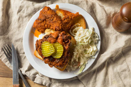 Homemade Nashville Hot Chicken with Bread and PIcklesの写真素材