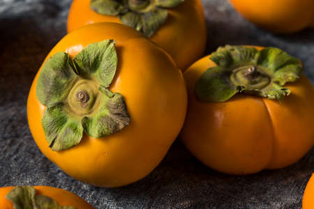 Raw Organic Orange Persimmons Ready to Eatの写真素材